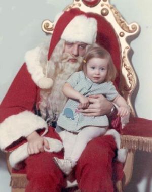 sleepy santa with little girl in vintage santa picture