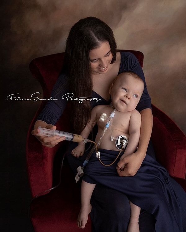 woman tube feeding her baby