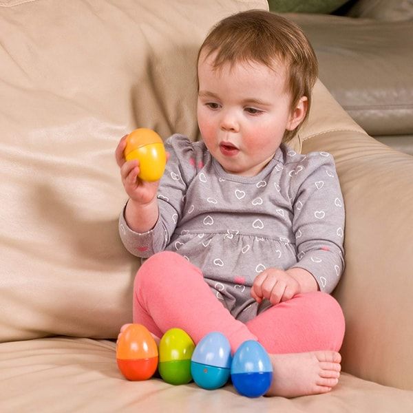 baby holding HABA Shakin Eggs