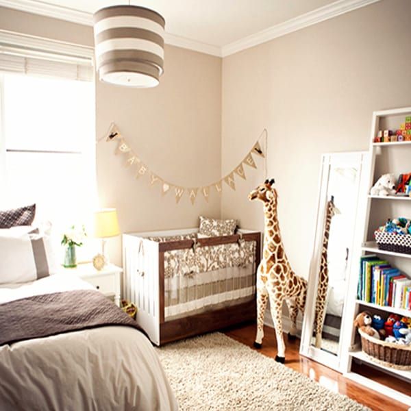 giraffe themed nursery nook tucked into corner of master bedroomgiraffe themed nursery nook tucked into corner of master bedroom