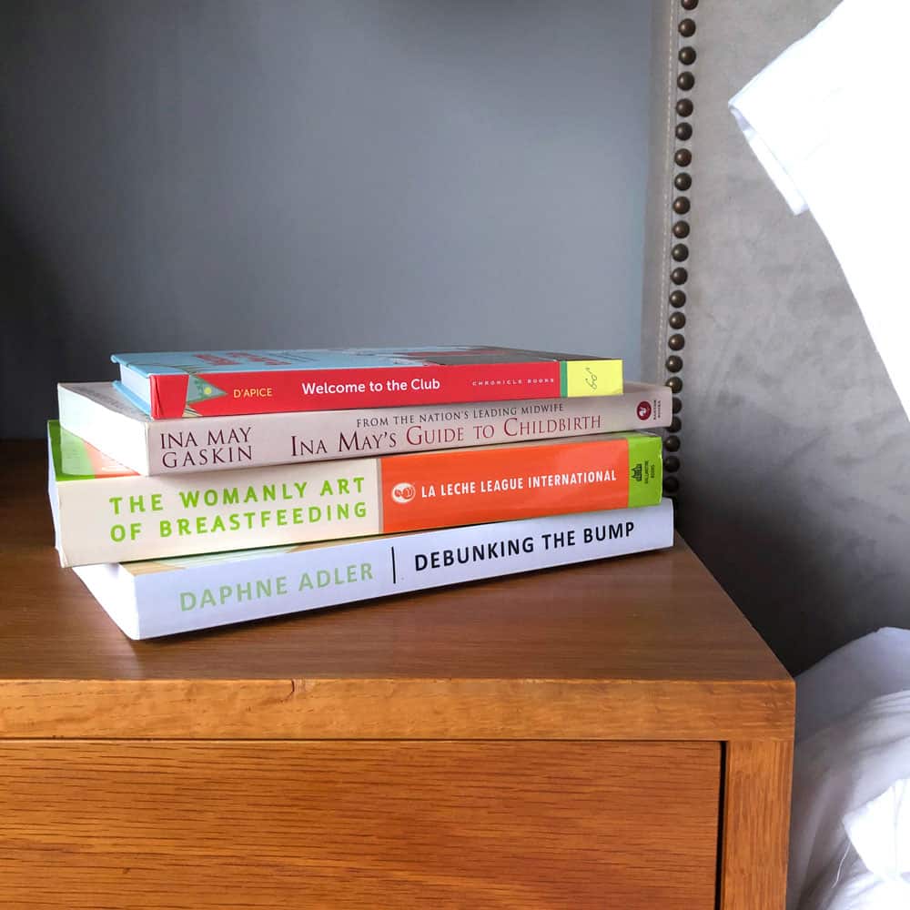 stack of four pregnancy books