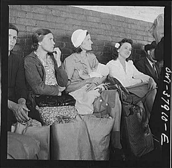 Black and white photograph of mother breastfeeding baby