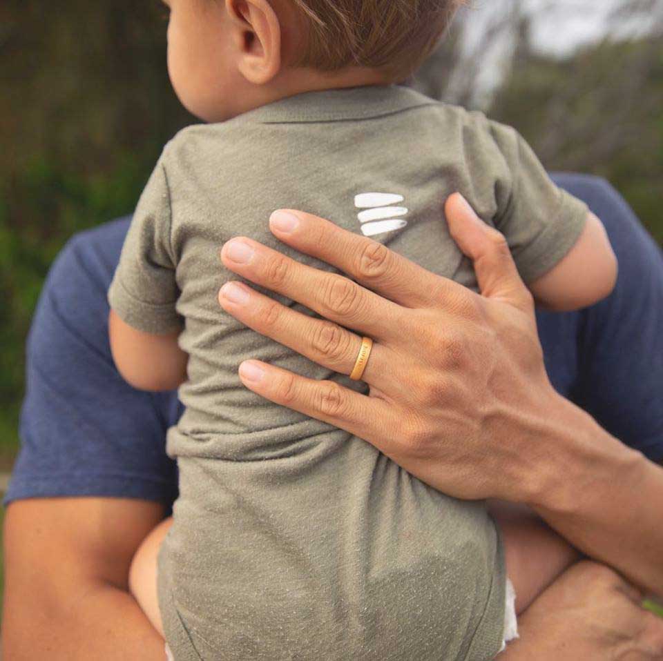 dad with enso ring holding baby