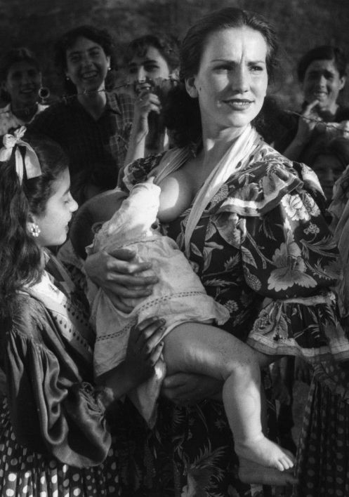 Black and white photograph of mother breastfeeding baby