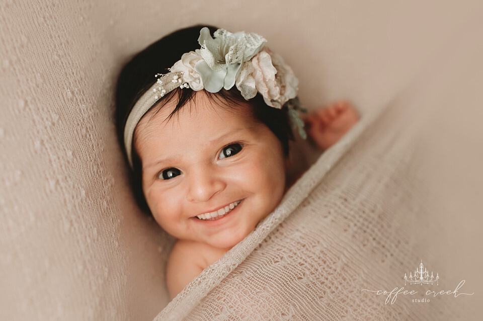 newborn baby with teeth photoshopped in.