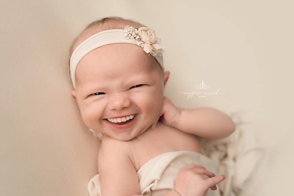 newborn baby with teeth photoshopped in.