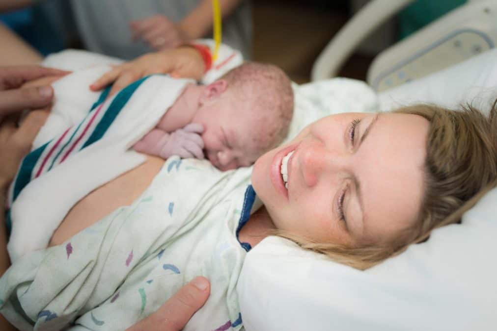 woman holding newborn