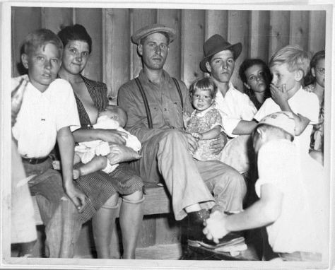 Black and white photograph of mother breastfeeding baby