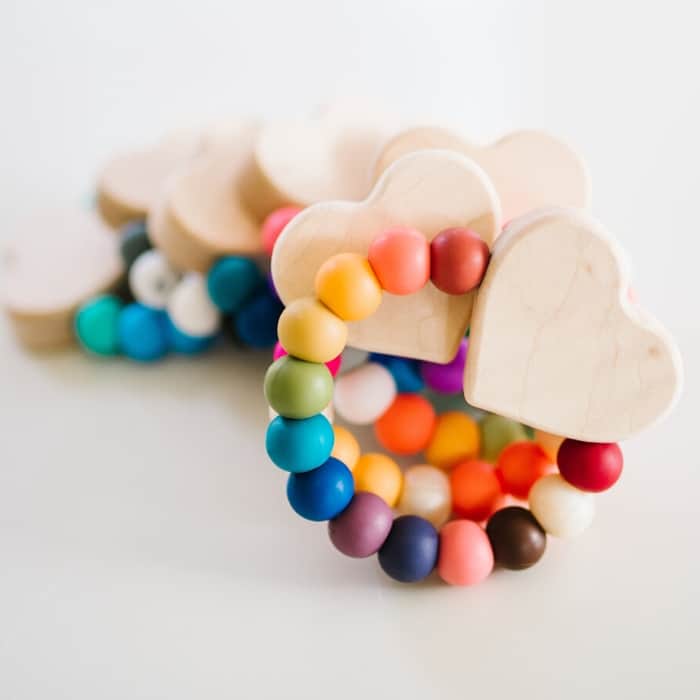 wooden heart teether with colorful beads - Baby’s First Valentine’s Day Gifts idea