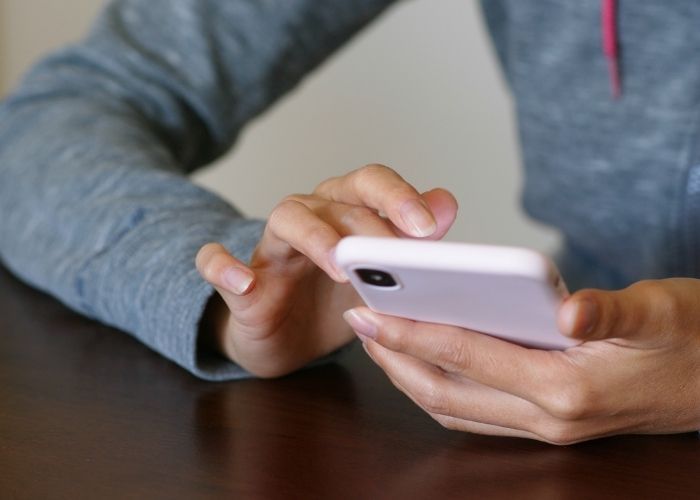 woman searching on smartphone