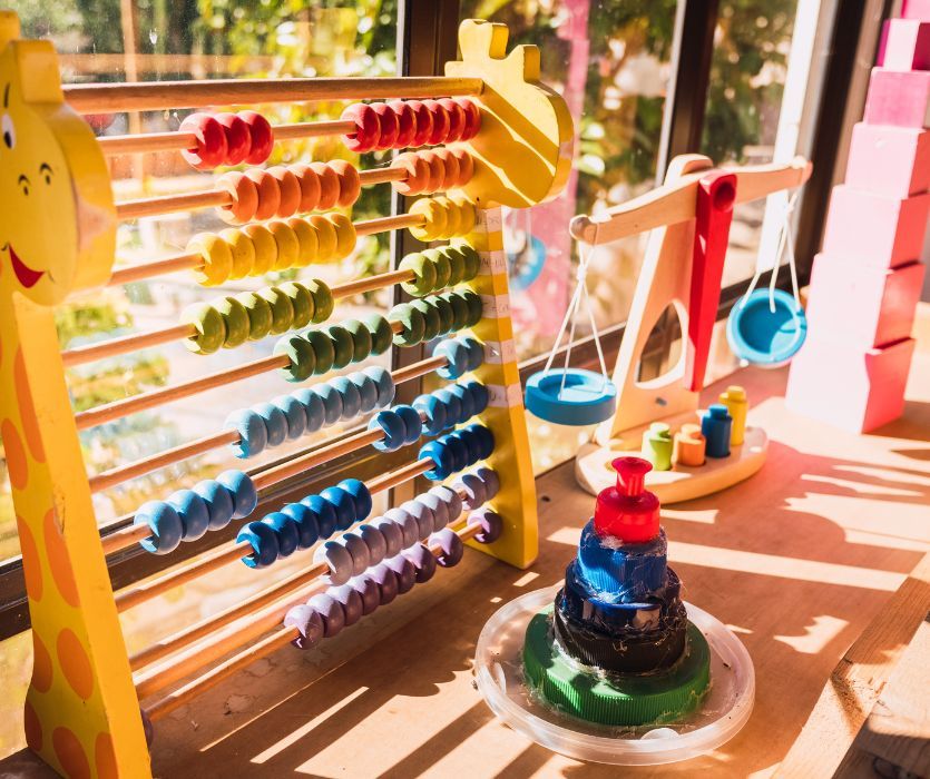 bright toys in a daycare window