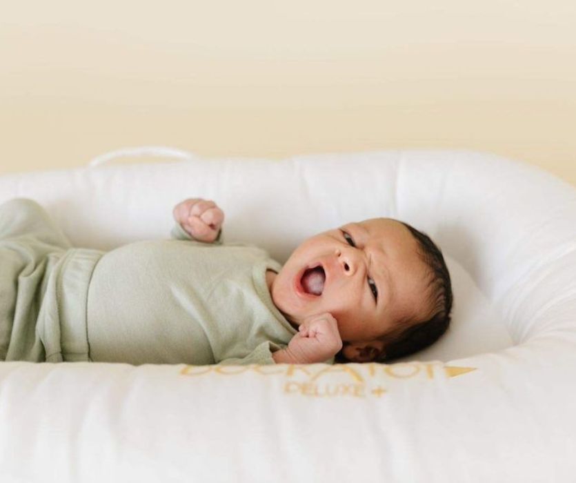 baby yawning in a dock a tot lounger