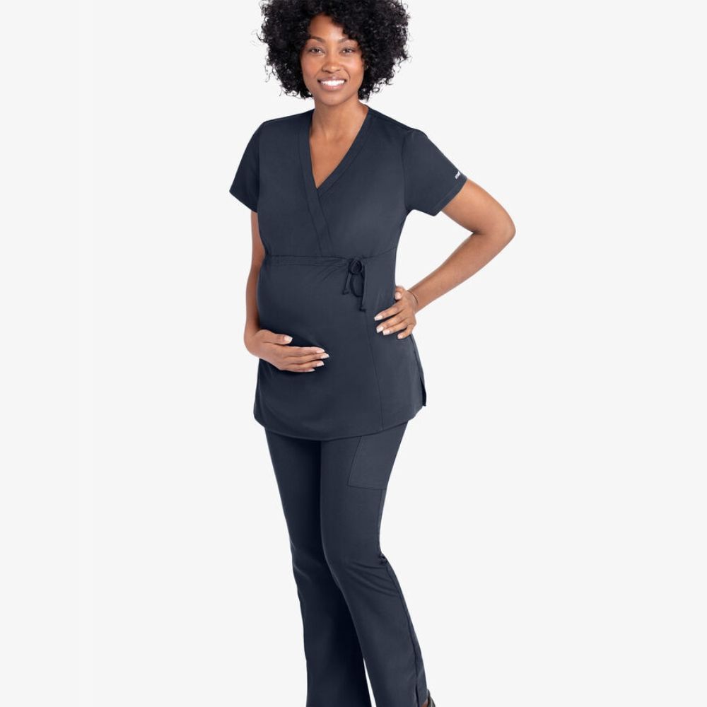 woman wearing navy maternity scrubs