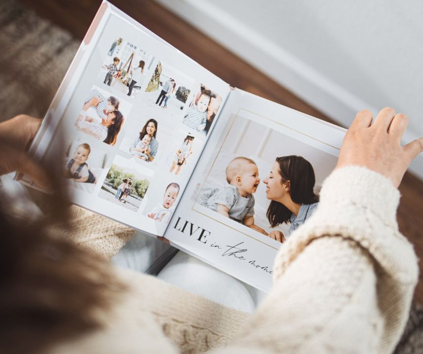 parent looking at a mixbook custom photo album