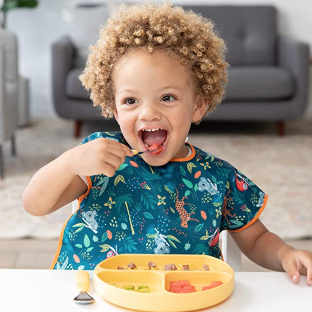 little boy wearing bib at grandma's house