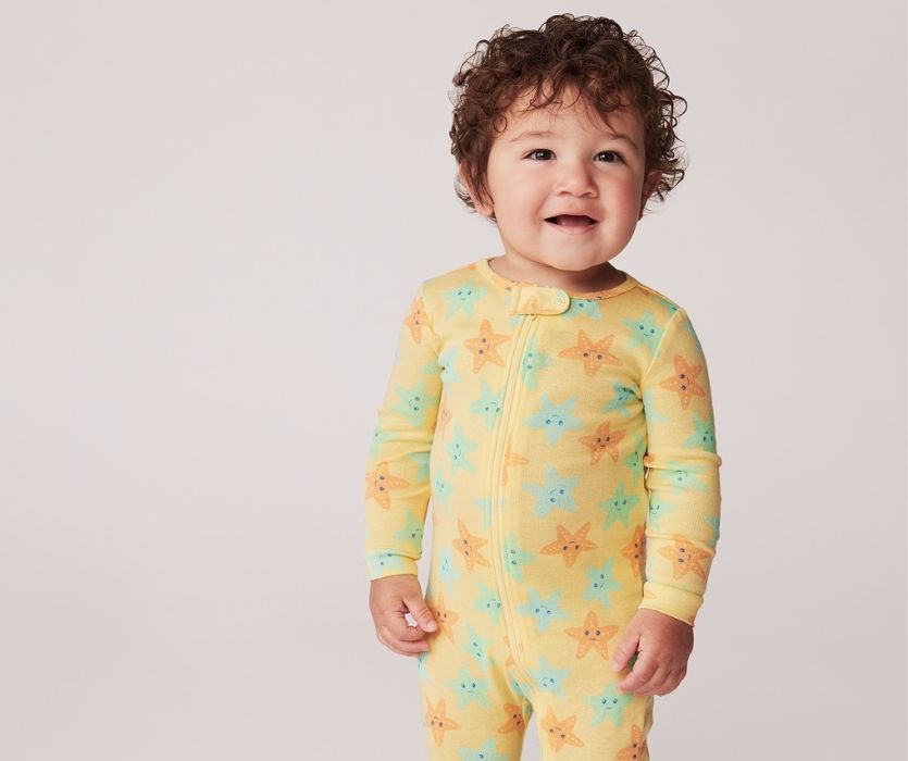 little boy wearing yellow starfish joe fresh sleepers